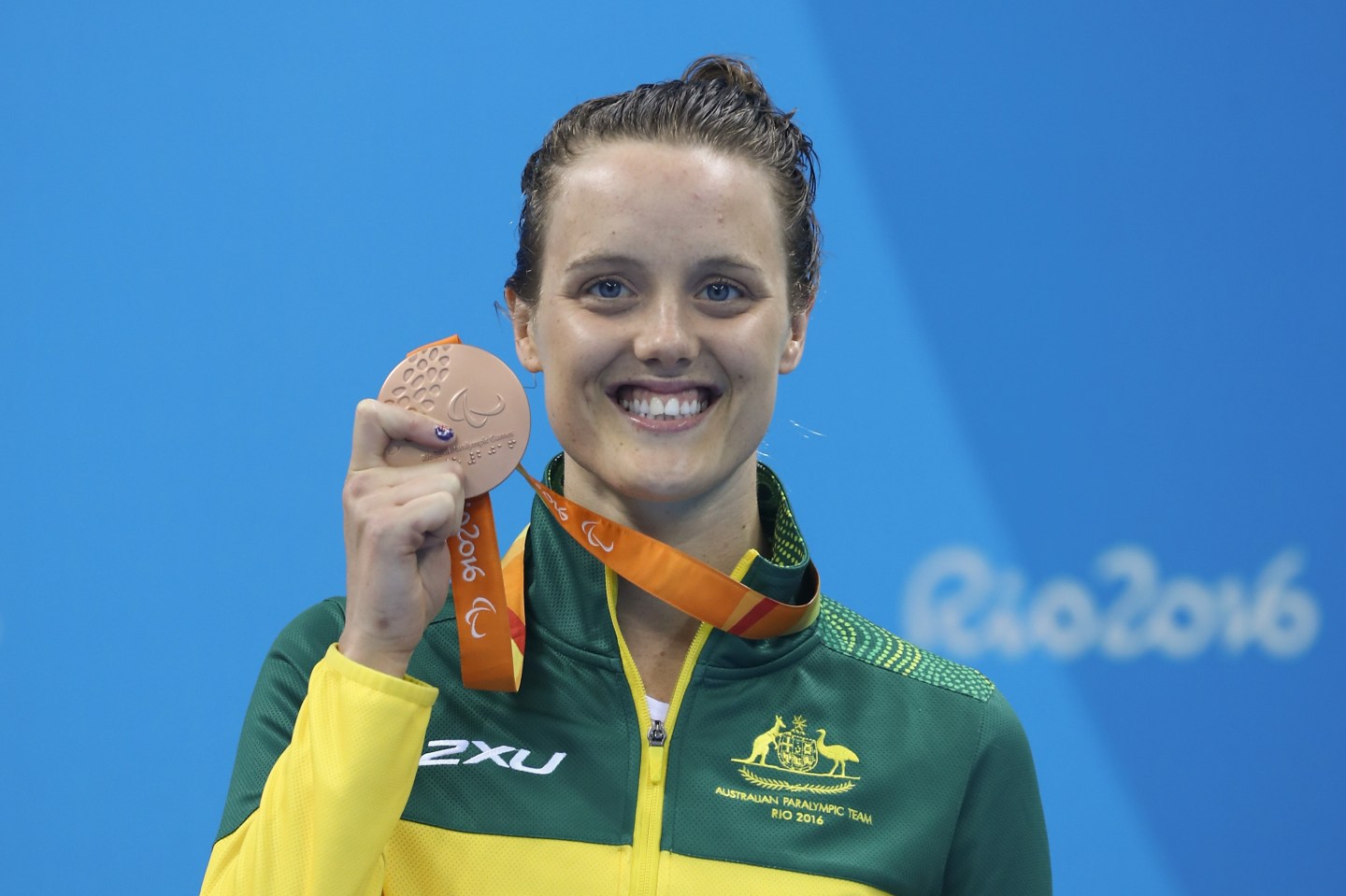 Bronze medalist Ellie Cole of Australia celebrates on the podium at the medal ceremony for the Womens 100m Freestyle - S9 Final during day 5 of the Rio 2016 Paralympic Games - Getty Images
